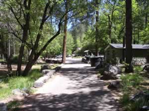 Looking past the restrooms towards the camp host.