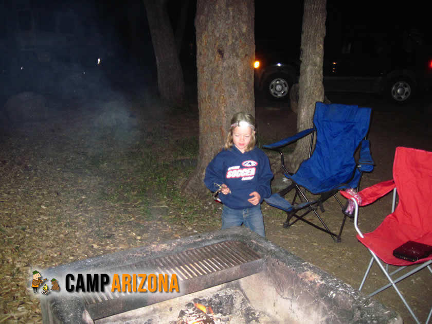 Enjoying a campfire at Cave Springs Campground